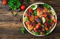 Chicken wings of barbecue in sweetly sour sauce. Picnic.