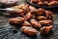 Chicken wings barbeque in a cast iron baking dish with BBQ sauce Royalty Free Stock Photo