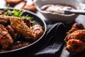 Chicken wings barbeque in a cast iron baking dish with BBQ sauce and rosemary Royalty Free Stock Photo