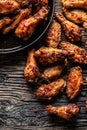 Chicken wings barbeque in a cast iron baking dish - Top of view Royalty Free Stock Photo