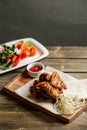 chicken wings grill. Serving on a white plate on a table. Barbecue restaurant menu, a series of photos of different Royalty Free Stock Photo