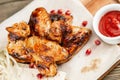 chicken wings grill. Serving on a white plate on a table. Barbecue restaurant menu, a series of photos of different Royalty Free Stock Photo