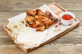 Chicken wings grill. Serving on a wooden Board on a rustic table. Barbecue restaurant menu, a series of photos of Royalty Free Stock Photo