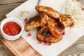 Chicken wings grill. Serving on a wooden Board on a rustic table. Barbecue restaurant menu, a series of photos of Royalty Free Stock Photo