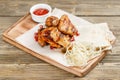 Chicken wings grill. Serving on a wooden Board on a rustic table. Barbecue restaurant menu, a series of photos of Royalty Free Stock Photo