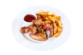 Chicken wings in hot sauce with French fries on a white plate. An isolated object. Top view Royalty Free Stock Photo