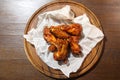 Chicken wings in hot sauce, specially prepared for beer. Chicken wings in hot sauce on a wooden plate. Royalty Free Stock Photo