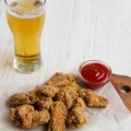 Chicken wings with sauce and cold beer, close-up. Side view. Copy space Royalty Free Stock Photo