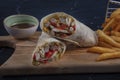 Chicken Wrap. Chicken fajita tortilla wrap sandwich. Tasty wraps with grilled chicken meat and fresh parsley Royalty Free Stock Photo