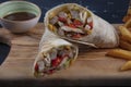 Chicken Wrap. Chicken fajita tortilla wrap sandwich. Tasty wraps with grilled chicken meat and fresh parsley Royalty Free Stock Photo