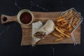 Chicken Wrap. Chicken fajita tortilla wrap sandwich. Tasty wraps with grilled chicken meat and fresh parsley Royalty Free Stock Photo