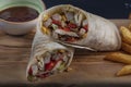 Chicken Wrap. Chicken fajita tortilla wrap sandwich. Tasty wraps with grilled chicken meat and fresh parsley Royalty Free Stock Photo