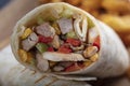 Chicken Wrap. Chicken fajita tortilla wrap sandwich. Tasty wraps with grilled chicken meat and fresh parsley Royalty Free Stock Photo