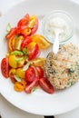 Chickenburger with tomato salad Royalty Free Stock Photo