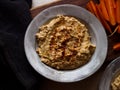 Chickpea hummus home made in natural light on farm table Royalty Free Stock Photo