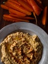 Chickpea hummus home made in natural light on farm table Royalty Free Stock Photo