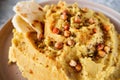 Chickpea hummus with olive oil, garlic, spices and sprinkled with fried chickpeas, simple recipes for cooking at home, close up, Royalty Free Stock Photo