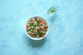 Chickpea salad with vegetables on a blue background. Summer vegetarian diet.