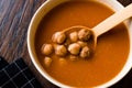 Chickpea Soup Stew with Meatballs and Wooden Spoon / Spanish Potaje de Garbanzos