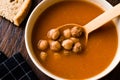 Chickpea Soup Stew with Meatballs and Wooden Spoon / Spanish Potaje de Garbanzos