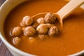 Chickpea Soup Stew with Meatballs and Wooden Spoon / Spanish Potaje de Garbanzos
