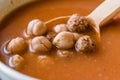 Chickpea Soup Stew with Meatballs and Wooden Spoon / Spanish Potaje de Garbanzos