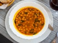 Chickpea and spinach curry stew on white plate