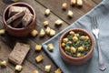 Chickpea and spinach stew on rustic wooden background. Spanish tapas.