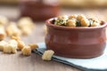 Chickpea and spinach stew on wooden background. Spanish tapas.