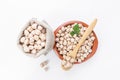 Chickpeas on a plate, bag and wooden spoon, top view, selective focus Royalty Free Stock Photo