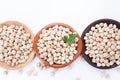 Chickpeas on plates on white background