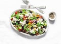 Chickpeas and vegetables salad with feta cheese on light background, top view. Vegetarian healthy diet food Royalty Free Stock Photo