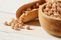 Chickpeas on a white wooden table, close-up