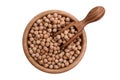 Chickpeas in a wooden plate and a wooden spoon on a white background