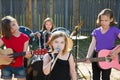 Chidren singer girl singing playing live band in backyard