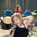 Chidren singer girl singing playing live band in backyard