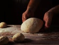 Chief baker preparing dough for bread in a bakery. Kitchen professional Royalty Free Stock Photo