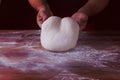 Chief baker preparing dough for bread in a bakery. Kitchen professional. Royalty Free Stock Photo