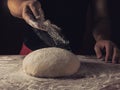 Chief baker preparing dough for bread in a bakery. Kitchen professional. Royalty Free Stock Photo