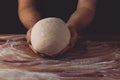 Chief baker preparing dough for bread in a bakery. Kitchen professional. Royalty Free Stock Photo