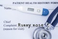 Chief complaint runny nose. Paper patient health history form, on which is written the complaint runny nose as the main reason for