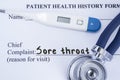 Chief complaint sore throat. Paper patient health history form, on which is written the complaint sore throat as the main reason f