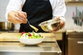 Chief cook preparing salad