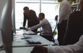 The chief manager and employees of the company interact and talk in the office. Meeting of the head with the staff to Royalty Free Stock Photo