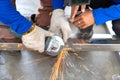 Chief mechanic training tecnician to use electric grinding