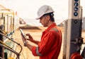 Chief officer or captain on deck of vessel or ship watching digital tablet