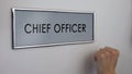 Chief officer door, hand knocking closeup, financial manager, leader position
