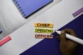 Chief Operating Officer text on sticky notes with color office desk concept