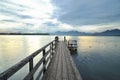 Chiemsee lake at sunries. Boat on the dock Royalty Free Stock Photo