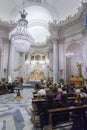 People taking part in the evening mass in Chiesa della Badia 